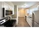 Modern kitchen with stainless steel appliances and granite countertops at 6235 Creekford Ln, Lithonia, GA 30058