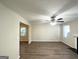 Bright living room with hardwood floors, neutral walls, and a fireplace at 6235 Creekford Ln, Lithonia, GA 30058