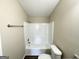 Clean bathroom with shower/tub combo and vinyl flooring at 7125 Rhodes St, Lithonia, GA 30058