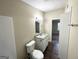 Updated bathroom with granite vanity and access to bedroom at 7125 Rhodes St, Lithonia, GA 30058