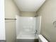 Clean bathroom with tub and shower combo at 7125 Rhodes St, Lithonia, GA 30058
