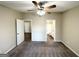 Carpeted bedroom with ceiling fan and access to bathroom at 7125 Rhodes St, Lithonia, GA 30058
