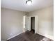 Bedroom with closet and view into hallway at 7125 Rhodes St, Lithonia, GA 30058