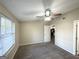 Spacious bedroom with window and view to kitchen area at 7125 Rhodes St, Lithonia, GA 30058