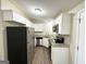 Well-equipped kitchen featuring stainless steel appliances and ample cabinet space at 7125 Rhodes St, Lithonia, GA 30058