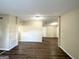 Open concept living room with hardwood floors and neutral wall colors at 7125 Rhodes St, Lithonia, GA 30058