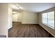 Spacious living area featuring hardwood floors and large windows at 7125 Rhodes St, Lithonia, GA 30058
