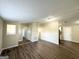 Bright and airy living room with hardwood floors and ample natural light at 7125 Rhodes St, Lithonia, GA 30058