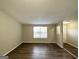 Living room with hardwood floors and entryway at 7125 Rhodes St, Lithonia, GA 30058