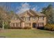 Brick two-story home with landscaped lawn and double-door entry at 16 Hawkstone Ct, Acworth, GA 30101