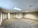 Finished basement room with neutral walls and carpet at 2370 Tiffany Cir, Decatur, GA 30035