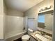 Clean bathroom with granite countertop, updated vanity, and tub shower combo at 2370 Tiffany Cir, Decatur, GA 30035