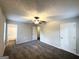 Large bedroom with ceiling fan and carpet flooring, plus access to bath and hallway at 2370 Tiffany Cir, Decatur, GA 30035