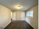 Bright bedroom with neutral walls and carpet, offering access to other rooms at 2370 Tiffany Cir, Decatur, GA 30035