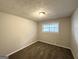 Spacious bedroom with neutral walls and brown carpeting at 2370 Tiffany Cir, Decatur, GA 30035