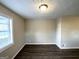 Simple dining area with hardwood floors and a large window at 2370 Tiffany Cir, Decatur, GA 30035