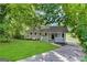 Ranch home with white porch and driveway at 2370 Tiffany Cir, Decatur, GA 30035