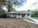 Gray ranch home with red door and landscaping at 2370 Tiffany Cir, Decatur, GA 30035