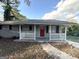 Gray house with red front door and white railing at 2370 Tiffany Cir, Decatur, GA 30035