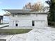 Gray two-story house with double garage doors at 2370 Tiffany Cir, Decatur, GA 30035