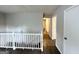 Hallway with white railing and doors to bedrooms at 2370 Tiffany Cir, Decatur, GA 30035