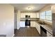 Updated kitchen featuring white cabinets, stainless steel appliances, and granite countertops at 2370 Tiffany Cir, Decatur, GA 30035