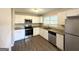 Modern kitchen with white cabinets, stainless steel appliances, and granite countertops at 2370 Tiffany Cir, Decatur, GA 30035