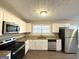 Modern kitchen with white cabinets and granite counters at 2370 Tiffany Cir, Decatur, GA 30035