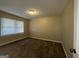 Spacious bedroom with neutral walls and carpet flooring at 2413 Ben Hill Rd, East Point, GA 30344