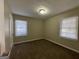 Well-lit bedroom featuring neutral walls and carpet at 2413 Ben Hill Rd, East Point, GA 30344