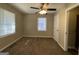 Bright bedroom with neutral walls, carpet flooring, and window blinds at 2413 Ben Hill Rd, East Point, GA 30344