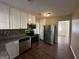 Modern kitchen with stainless steel appliances and granite countertops at 2413 Ben Hill Rd, East Point, GA 30344