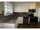 Modern kitchen with stainless steel appliances and granite countertops at 2413 Ben Hill Rd, East Point, GA 30344