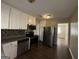 Updated kitchen featuring stainless steel appliances and granite countertops at 2413 Ben Hill Rd, East Point, GA 30344