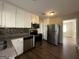 Modern kitchen with stainless steel appliances and granite countertops at 2413 Ben Hill Rd, East Point, GA 30344