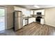 Modern kitchen with white cabinets, stainless steel appliances, and granite countertops at 685 Sheppard Rd, Stone Mountain, GA 30083