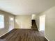 Living room with hardwood floors, staircase, and neutral color walls at 685 Sheppard Rd, Stone Mountain, GA 30083