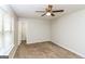 Bright bedroom with neutral walls, carpeting and a view of the backyard at 215 Shadow Wood Dr, Douglasville, GA 30134