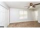 Spacious bedroom with neutral walls and carpeting, plus a double door closet at 215 Shadow Wood Dr, Douglasville, GA 30134