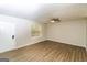 Spacious living room with wood-look floors and ceiling fan at 215 Shadow Wood Dr, Douglasville, GA 30134