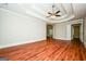 Spacious bedroom with hardwood floors and ceiling fan at 3033 Players Dr, Jonesboro, GA 30236