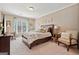Cozy bedroom with a king-size bed and a sitting area at 2909 Everson Ridge Ct, Snellville, GA 30039