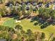 Golf course community with large homes and lush trees at 6857 Louis Dr, Locust Grove, GA 30248