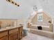 Bathroom with soaking tub, wood vanity, and tile flooring at 32 Peeksville Rd, Locust Grove, GA 30248