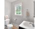 Simple bathroom with white sink, toilet and shower at 32 Peeksville Rd, Locust Grove, GA 30248