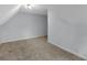 Spacious bonus room with neutral walls and carpet at 32 Peeksville Rd, Locust Grove, GA 30248