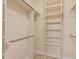 Walk-in closet with shelves and hanging rods at 32 Peeksville Rd, Locust Grove, GA 30248