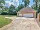 Two-car detached garage with spacious driveway at 32 Peeksville Rd, Locust Grove, GA 30248