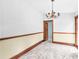 Dining room with hardwood floors, chandelier, and access to other rooms at 32 Peeksville Rd, Locust Grove, GA 30248