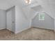 Charming dormer bedroom with carpet, window, and closet at 32 Peeksville Rd, Locust Grove, GA 30248